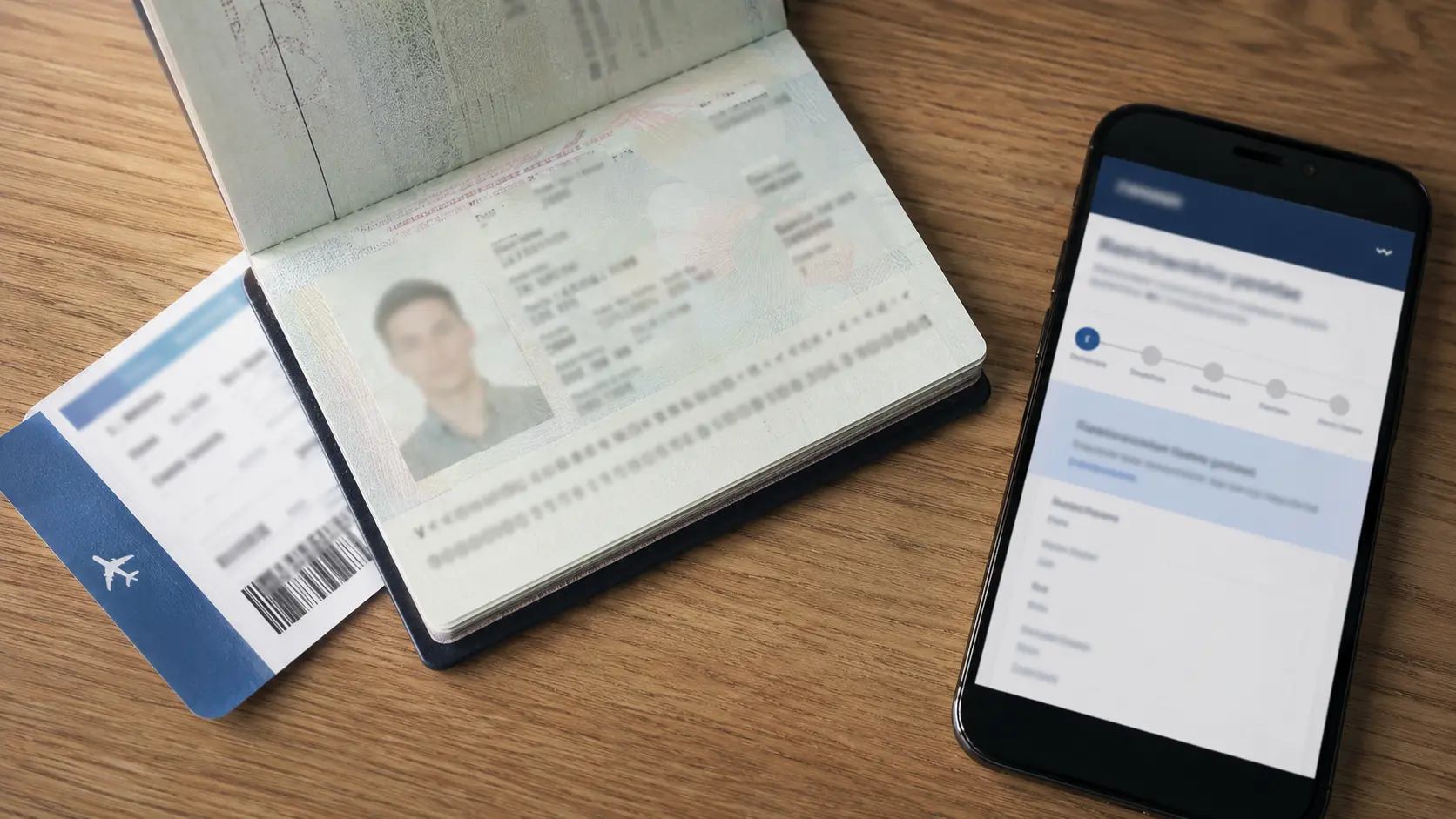Passport and phone used to run a UAE visa status check by passport number